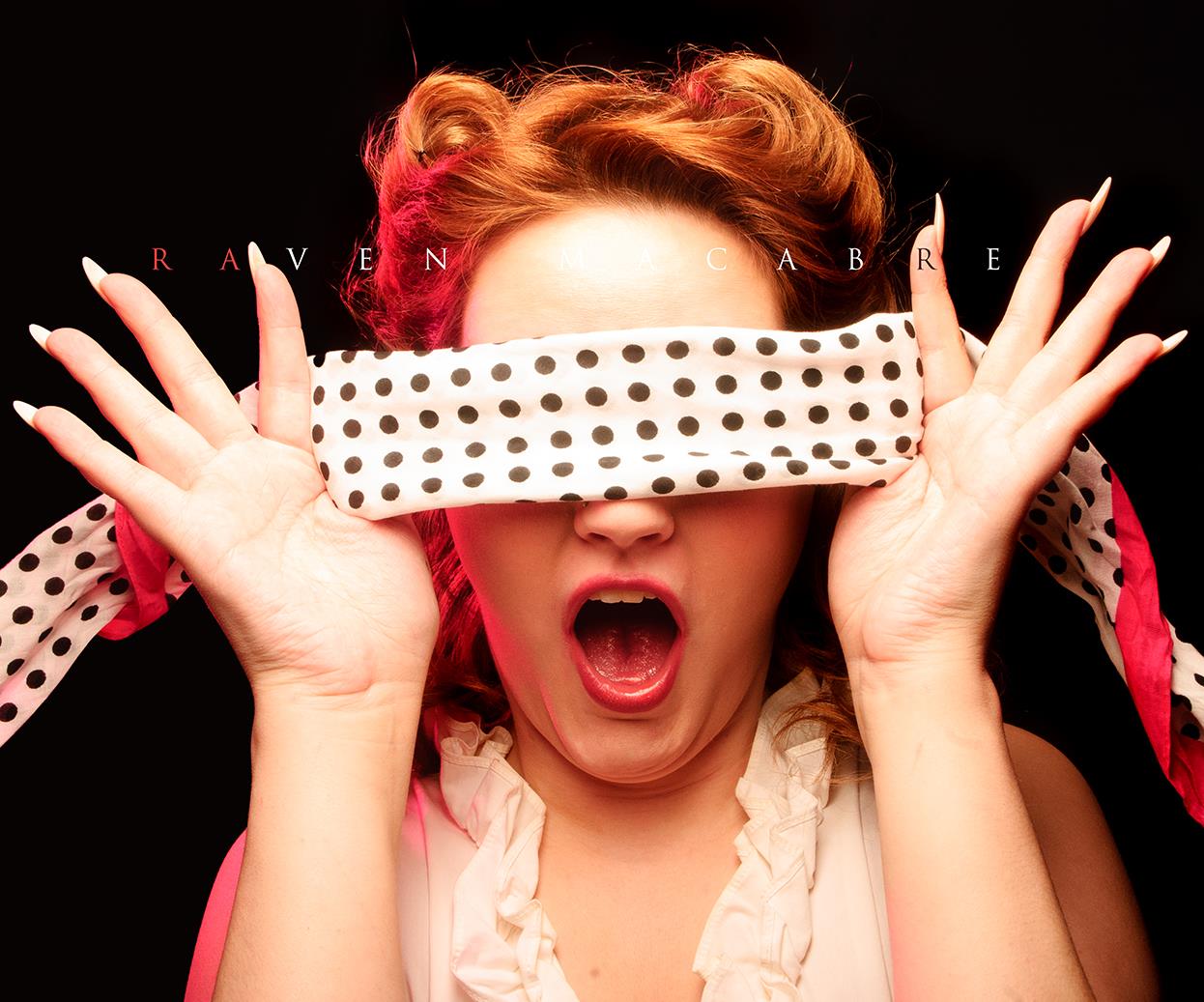 Pop editorial portrait with polka dot blindfold