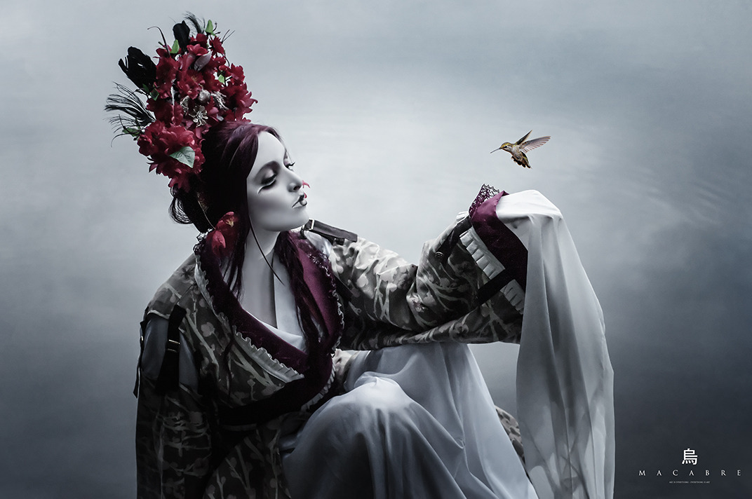 Fine art portrait of a woman in a kimono with floral headpiece beside water